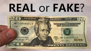 Of the two $20 bills shown, one of them is fake. How To Tell If A 20 Bill Is Real Or Fake Youtube