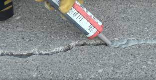 Remove any vegetation growing along the edges of the driveway or in the holes or cracks in asphalt. The Best Asphalt Crack Filler For Your Driveway The Saw Guy