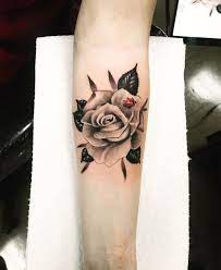 A floral tattoo is often a good first tattoo for a woman who wants something fairly subtle. Tattoo Artist On Instagram Small But Funny Ladybugs And Rose Ladybugstattoo Ladybugtattoo Ros Lady Bug Tattoo Tattoos Tattoo Artists
