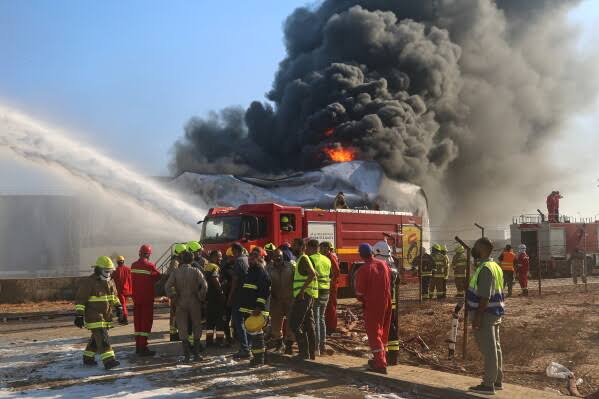Thick plumes of black smoke rise from the Zawiya oil refinery in Libya following a drone strike.