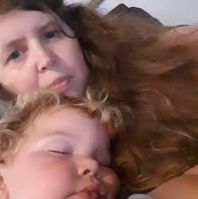 What are some solo playable game gift ideas for an 80-year-old woman who  likes word and card games?