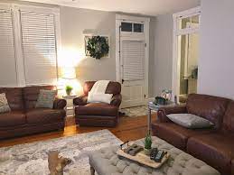 Sherwin Williams Repose Grey Paint Brown Leather Couch Recliner And Love Seat Boxwood Wreath An Brown Couch Living Room Living Room Grey Brown Living Room