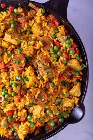 Chicken And Chorizo Paella Girl With The Iron Cast Chicken Paella Paella Recipe Paella Recipe Chicken