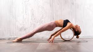 Our easy, medium, and hard positions are fun and challenging as a couple. Yoga Wheel Mania Is The Trendy Prop Really Worth It