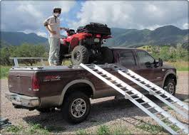 Customer On Top Of His Diamondback Hd Truck Bed Cover With His Trophy Buck Truck Covers Truck Bed Covers Aluminum Truck Beds