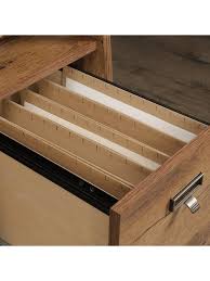 This computer desk features two small drawers that open and close on smooth metal runners for easy access storage of supplies. Sauder Trestle Executive Desk Vintage Oak Office Depot