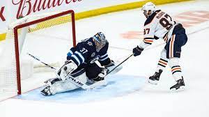 Winnipeg jets center mason appleton (22) and edmonton oilers defenceman darnell nurse (25) watch as edmonton share this story: K4x H 6ffk0sym