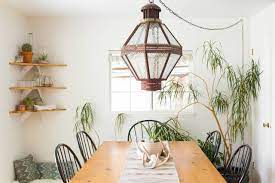 In this boho dining room, a colorful rug in shades of magenta, yellow, and blue invigorates the space with boho energy—its vibrant palette is echoed in the room's accessories. Bohemian Dining Room Ideas Photos Houzz