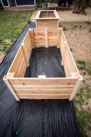 This raised bed is made from concrete blocks and topped off with timber sleepers to provide extra seating space, invaluable in a small garden. Tall Raised Garden Beds Plans Diy Live Free Creative Co