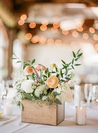 The classic rustic wedding theme centers around rustic wedding decorations such as birch vases, mason jars, barn wedding venues all while being surrounded by nature. Rustic Wedding Reception Table Decor With Peach And Coral Floral With Wild Greenery In Wooden Box Small Centerpiece Marry Me Tampa Bay Local Real Wedding Inspiration Vendor Recommendation Reviews