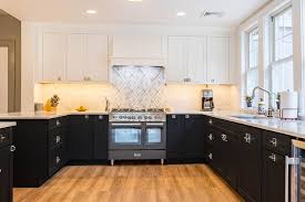 Get the brass hardware to compliment them. Using Color For Eye Catching Two Tone Kitchen Cabinets