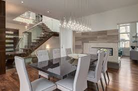 Stunning dining room with ocean views and a contemporary stone fireplace. Contemporary Dining Room With Two Way Fireplace And Custom Stair Modern Dining Room Other By Phase One Design Houzz