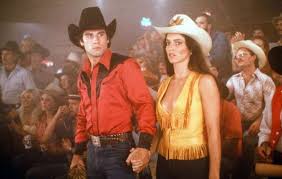 After moving to pasadena, texas, country boy bud davis starts hanging around a bar called gilley's, where he falls in love with sissy, a cowgirl who believes the sexes are equal. Bud And Pam At Gilley S Nightclub Urban Cowboy Urban Cowboy Movie Urban Cowboy Style