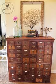 The addition of faux drawer fronts, shiny brass labeled cup pulls, and wheels, it now looks like a card catalog and functions as a desk. Junk In The Trunk Library Card Cabinet Library Card Catalog Card Catalog Ikea Storage Cabinets