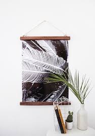 Yes, you could paint a mural, and yes, you could hang up average picture frames. Diy Hanging Half Frame Design Sponge