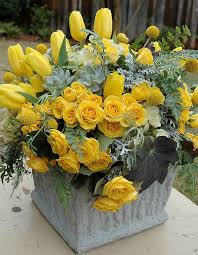 A blue floral vase with pink a lovely spring flower arrangement of snowdrops in moss wrapped with bark is a beautiful rustic spring decoration to rock. Yellow And Grey Beautiful Flower Arrangements Beautiful Flowers Yellow Roses