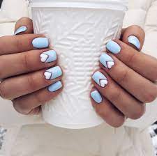Geometric nail art has been in the fashion since the autumn/winter 2012 catwalks, but the only thing that has changed in them since the time is that, these nail art designs have become chicer, subtler and whole lot cooler than before. Ideas For Winter Nails Light Blue With White Hearts Nail Design Instagram Veronikaslipa Heart Nail Designs Blue And White Nails Blue Nail Designs