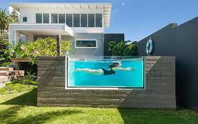 Chafey designed and built a rooftop pool with glass panels on the outside edge, where it could be viewed from the yard below. Pool Windows Acrylic Pool Viewing Installations For Residential Or Commercial Applications Aus Small Backyard Pools Swimming Pool House Courtyard House Plans