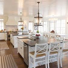 We're seeing nicer dining areas rather than a simple kitchen table, or a breakfast room opening up into the space. Double Kitchen Islands Design Ideas