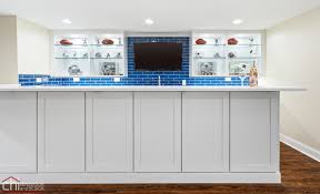 The cost of adding a bar to a basement ranges from $500 to $20,000 or more. Barrington Basement Remodel Theater Bar Gym Bath