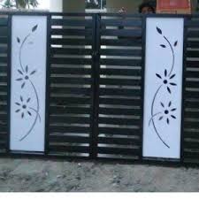 The classic metal gate leading to a forested area with stone pillars evokes a feeling of mystery and drama. Simple Flower Gate Design Steel Gate Design Iron Gate Design Grill Gate Design