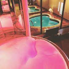 The 7 Champagne Tower Overlooks The Heart Shaped Tub At Cove Haven Resort Unusual Hotels Romantic Getaways Romantic Bathrooms