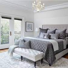 Layers of plush bedding and a deeply tufted fabric headboard create a comfortable and restorative sleeping space. Home Designs Simple Bedroom Design Simple Bedroom Bedroom Interior
