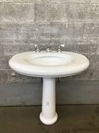 The pedestal is caulked on top and buttom. Repro Kohler Pedestal Sink Second Use