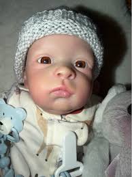 New reborn doll created and painted in my home studio . Vinyl limbs and  head with cloth body . Comes with clothing , magnetic soother and clip ,  toy and bottle of