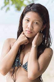 Attractive Busty Filipina Woman With A Serious Thoughtful Expression Standing In Her Bikini Looking At The Camera Stock Photo Picture And Royalty Free Image Image 26794991
