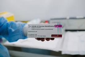 The company logo for pharmaceutical company astrazeneca is displayed on a screen on the floor at the new. Oxford Astrazeneca Vaccine Expert Reaction Lshtm
