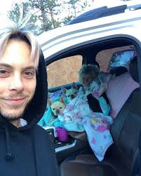 Road trip! Mom holding her all her dogs! 😂