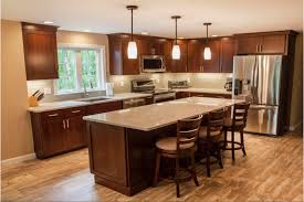 The light beige marble tile floor works well with the brown cabinets and the granite countertop of the kitchen island. 75 Beautiful Vinyl Floor Kitchen With Brown Cabinets Pictures Ideas June 2021 Houzz