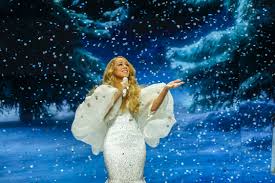 Mariah Carey Celebrates Her Return to Stage by Signing Rihannas Boob