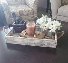 Plan Your Coffee Table Decor Well And See The Refreshing Change Immediately Distressed Decor Decorating Coffee Tables Rustic Wood Decor
