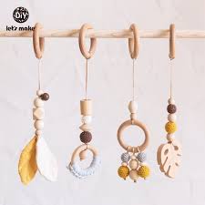 Whether you call it a playmat, play gym or an activity gym, the idea is the same: 4pcs Set Baby Mobile Wooden Rattle Natural Wood Leaves Baby Play Gym Hanging Toys Crib Mobile Kids Toys Baby Soother Kinderwagen Spielzeug Wish