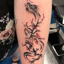 It features a winged dragon perched atop of a gorgeous blue rose with pretty greenery and a sparkly, celestial backdrop that creates movement and interest in the design. Top 57 Best Dragon Tattoos For Women 2021 Inspiration Guide