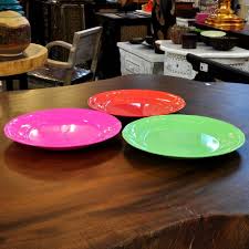 When combined with formaldehyde, melamine becomes melamine resin, a substance that can be molded to create tableware when heated. Flat Round Plate From Melamine In Garishly Neon Colours
