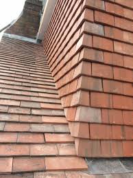 Ridges are built like those on pitch roofs however gutters (if provided) drain. M R Roofing Corner Of A Tiled Dormer Window Facebook