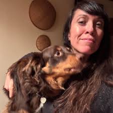 Can you identify the craftswoman who made the crochet dolls?