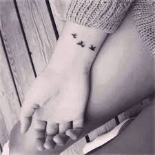 Three Birds In Flight Tattoo Little Wrist Tattoo Of Three Birds Flying Bird Tattoo Wrist Tattoos Tattoo Designs For Girls