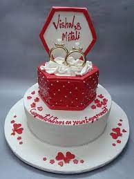 Engagement cakes can be a great way to boost festive cake sales especially when the margin on christmas cakes is quite low for specialty cake decorators. Best Engagement Cake Shop In Mumbai Deliciae Cakes Engagement Cake Design Engagement Party Cake Engagement Cake Images