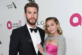 As for the groom, he opted for a black suit and black tie, but swapped the dress shoes for white vans sneakers. Miley Cyrus And Liam Hemsworth Wedding Dress Location And More