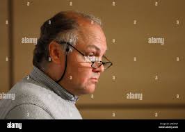 Medical examiner, Dr. Carl Schmidt talks to he media after releasing Luqman Ameen  Abdullah's autopsy report Monday, Feb. 1, 2010 in Detroit. Schmidt said the  Muslim prayer leader was who shot 20