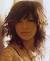 Short Curly Hair With Side Swept Bangs