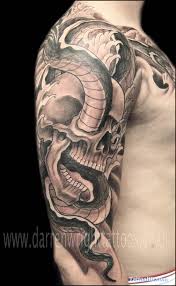 A great tattoo design of an ornate sword that is embedded into the skin and coming out the other side. 35 Amazing Skull And Snake Tattoos