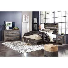Black and white, black and white artwork, east london, pattern design, urban style medium sized industrial master bedroom in london with white walls, dark hardwood flooring and brown floors. Signature Design By Ashley Drystan 6 Piece Queen Bedroom Set