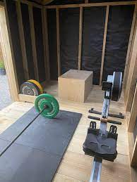 Built A Little Home Gym Any Ideas For Flooring To Help The Barbell Bounce Would A Plywood Layer Help Just Has Decking On Gym Rubber So Think We Need Something Harder Crossfit