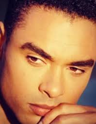 Is the similarity in dress between characters and a portrait a  foreshadowing of their relationship?