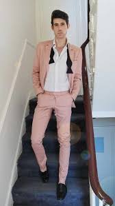 Black And Pink Suit 10 Reasons Why We Are Loving Pastel Suits For Men Pink Suit Men Mens Fashion Suits Wedding Suits Men